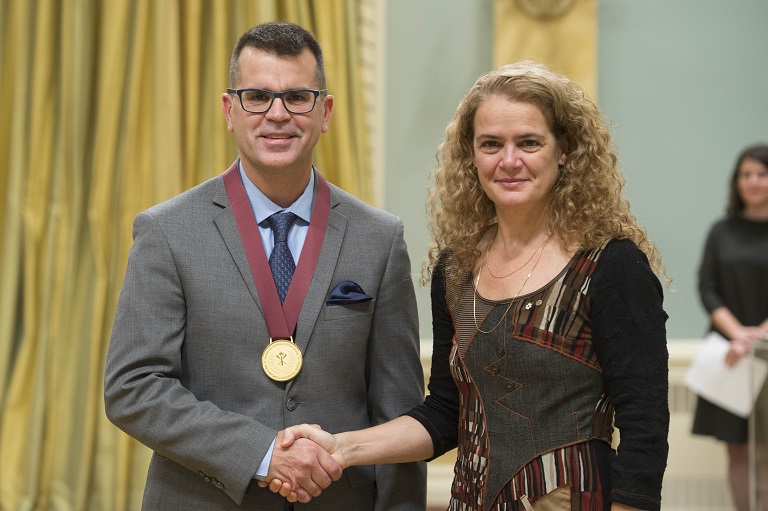 Rob Flosman shakes hands with the Governor General Julie Payette