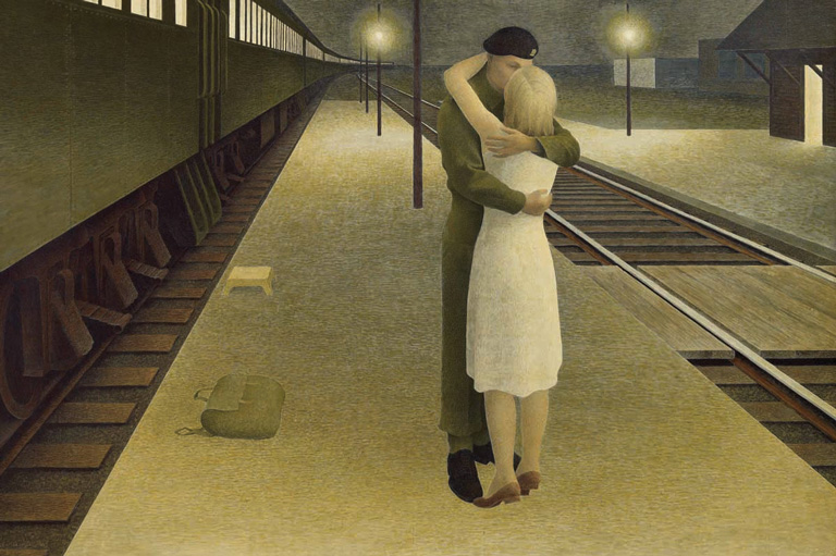 A soldier and a women embrace beside train tracks. 