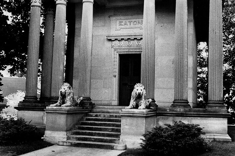 Black and white photo of the entryway to the Eaton family mausoleum. 