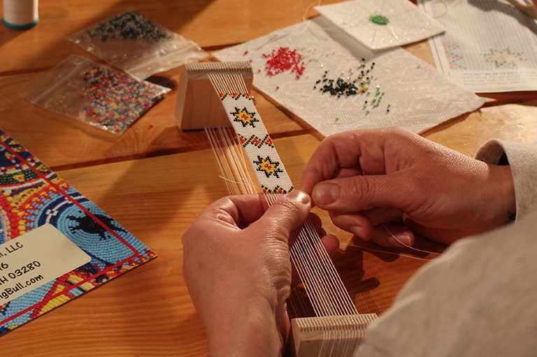 Image of beading on a loom. 