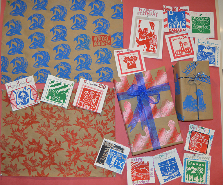 Image shows hand made wrapping paper and cards. 