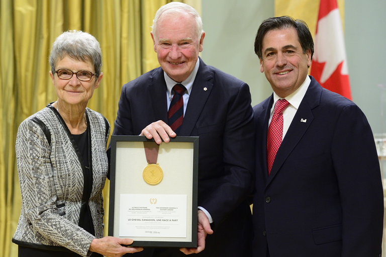 Madeleine Juneau and Pierre Rodrigues accepting their award on behalf of la Maison Saint-Gabriel at Rideau Hall in Ottawa.