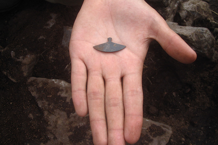 A tiny Ulu in the palm of a hand. 