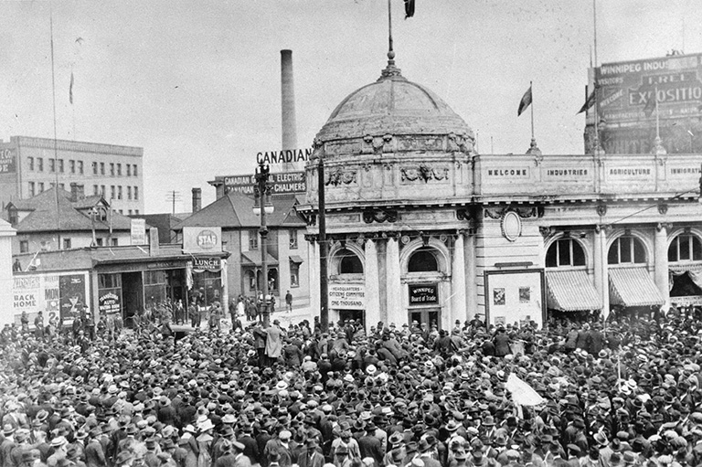 A crowd of people outside of a building. 