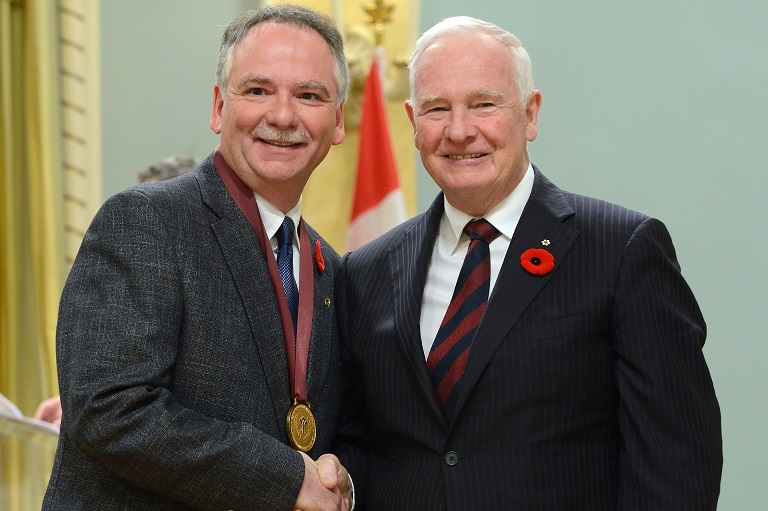 Gérald Charron accepting his award at Rideau Hall, 2014.