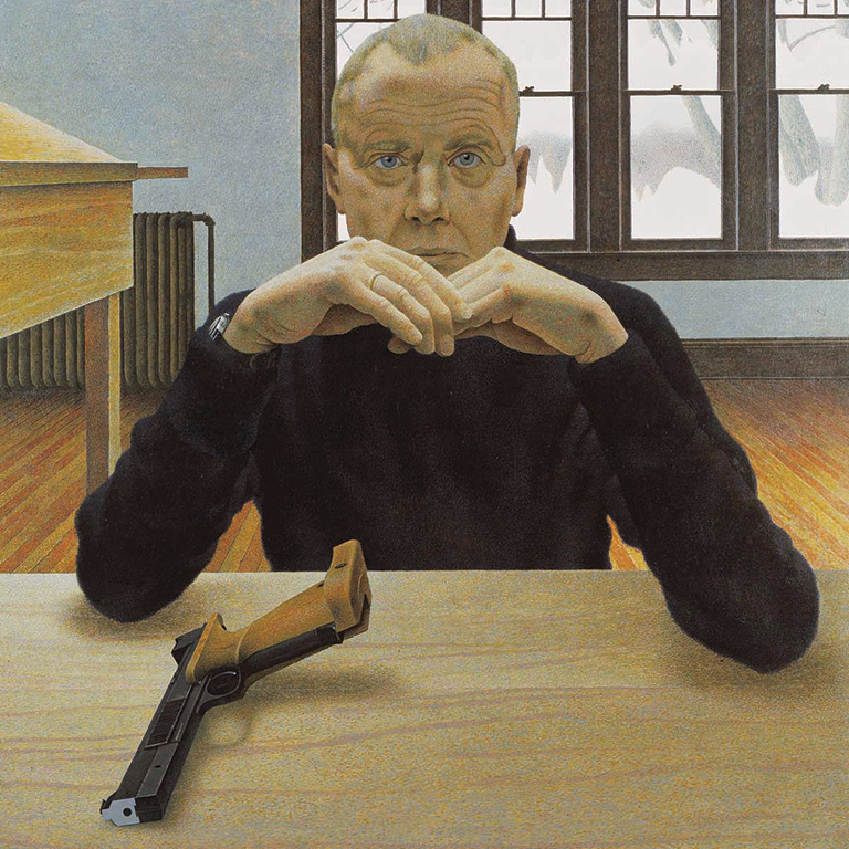 Man sits with elbows on table, hand in front of chin, pistol sits on table. 