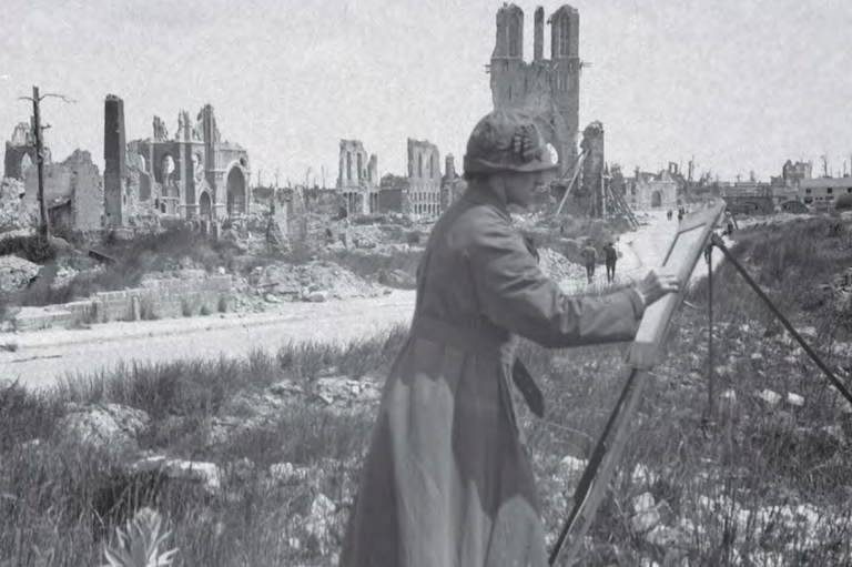 Black and white photo of a female artist painting on an easel, the ruins of stone buildings are visible in the background.