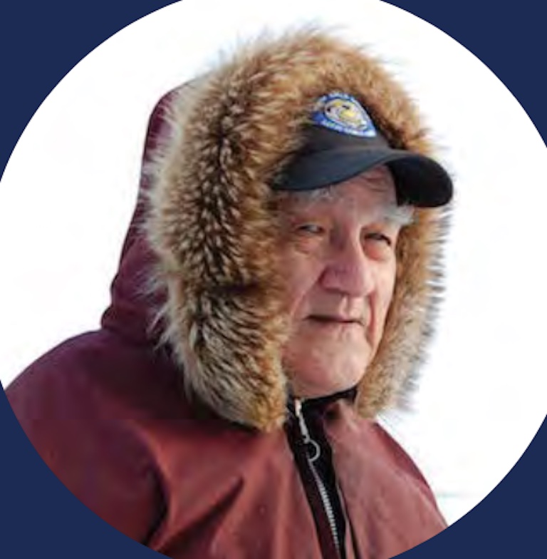 Portrait of Mark Kalluak in a parka and baseball cap.