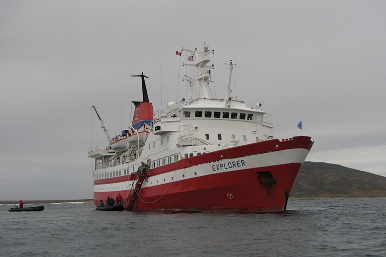 Passengers aboard the MS <i>Explorer</i> prepare to head out on Zodiacs to explore the Arctic waters of the Northwest Passage. Voyagers to the Arctic can see plenty of wildlife, including walrus, narwhals, and polar bears.