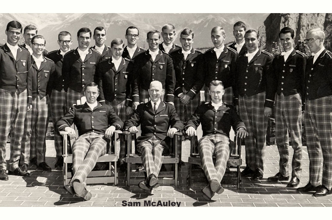Fairmont Banff Springs bellhop staff in uniform, mountains in background.