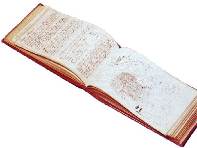 A notebook opened to show a spread of writing.