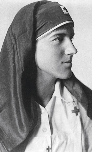 A portrait image of woman in a nursing sister's uniform