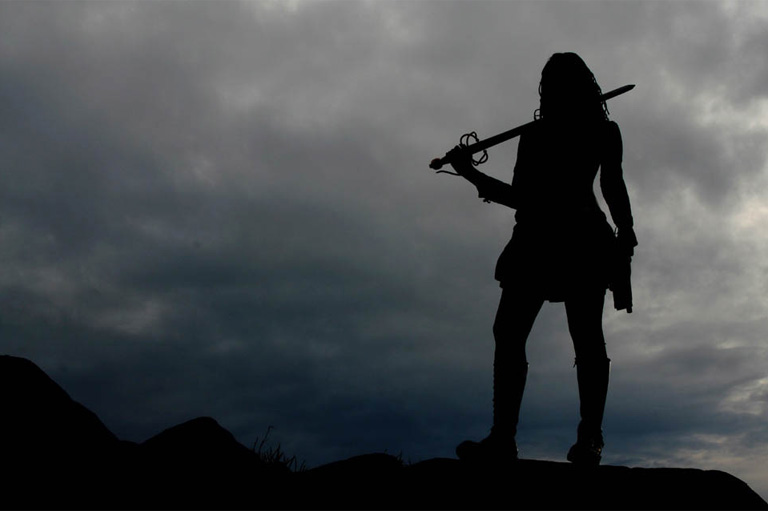 Silhouette of swordswoman